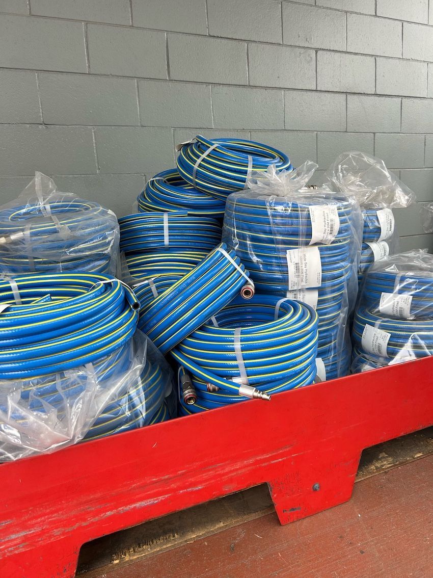 A Blue Air Compressor Is Sitting On The Floor In A Warehouse — Wide Bay Hydraulics in Hervey Bay, QLD