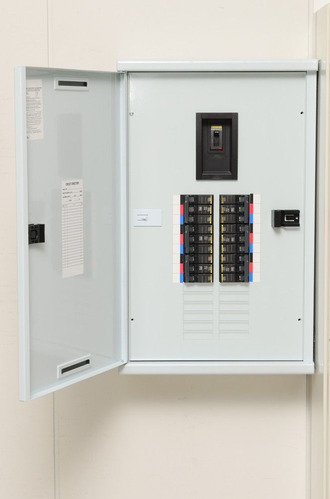 A White Electrical Box With the Door Open is Hanging on a Wall — A J Wilcox Air & Electrical in Banora Point, NSW