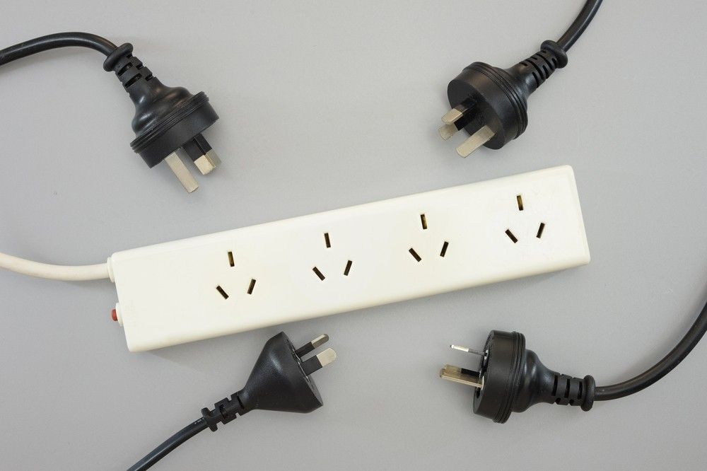 A Power Strip With a Bunch of Plugs Attached to It — A J Wilcox Air & Electrical in Banora Point, NSW