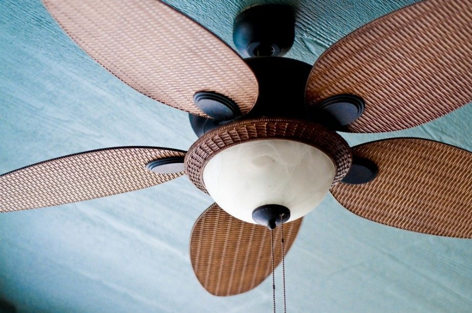 A Ceiling Fan With Wicker Blades and a Light — A J Wilcox Air & Electrical in Banora Point, NSW