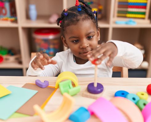 child playing and learning