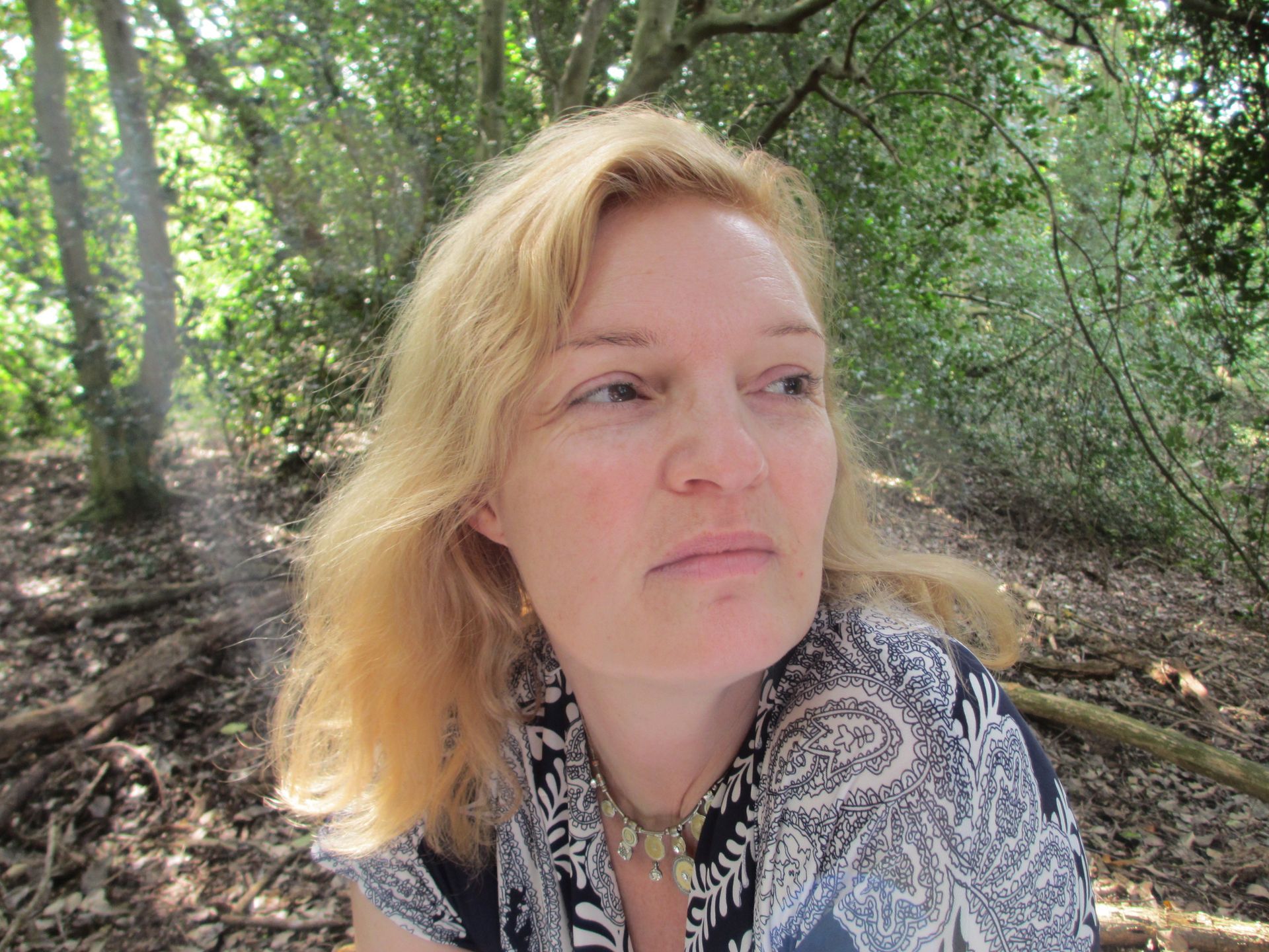 Woman looking thoughtful as she contemplates self-love
