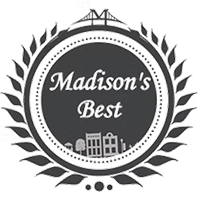Circular black-and-white logo reading “Madison’s Best” with laurel wreath and city skyline icon
