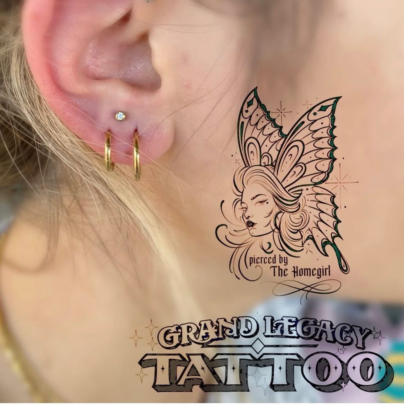 Close-up of ear with gold hoop earrings beside a black butterfly tattoo design and “Grand Legacy Tattoo” logo