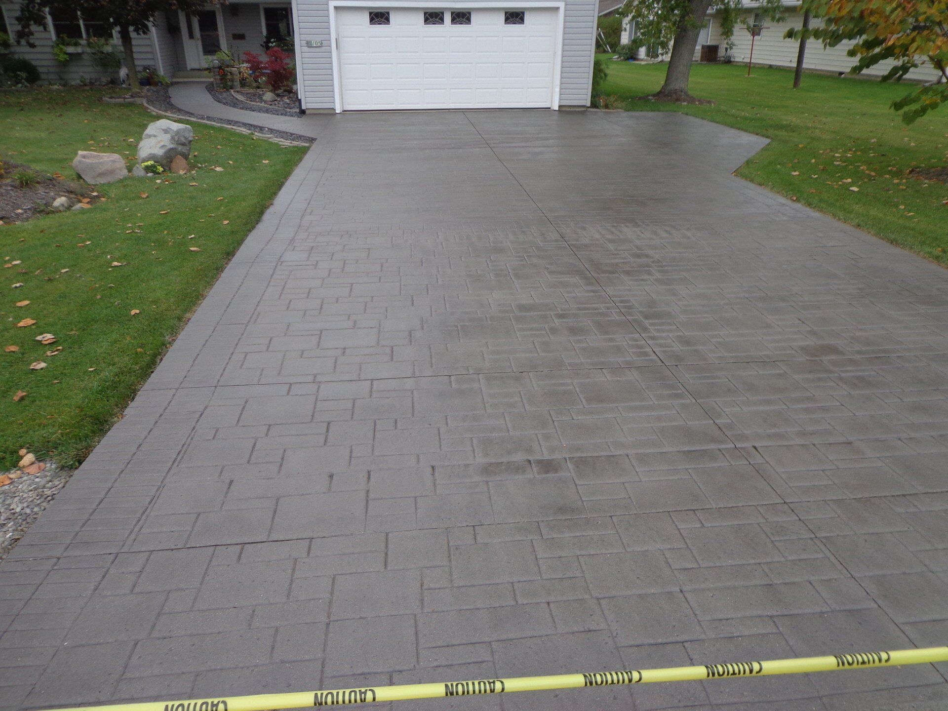 a stamped concrete driveway is installed