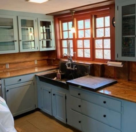 A kitchen with granite counter tops and hardwood floors