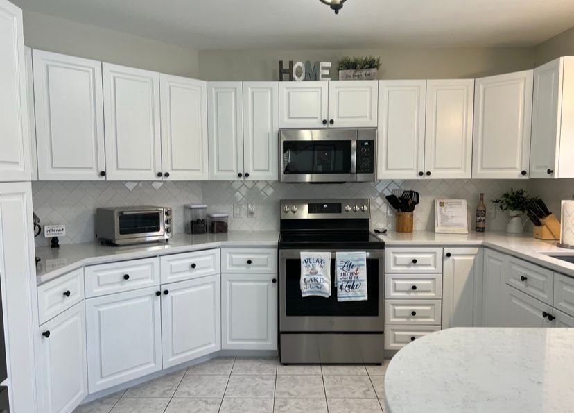 A kitchen with granite counter tops and hardwood floors