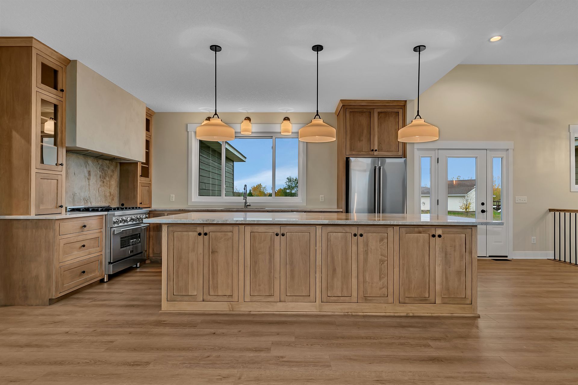 There is a large island in the middle of the kitchen.