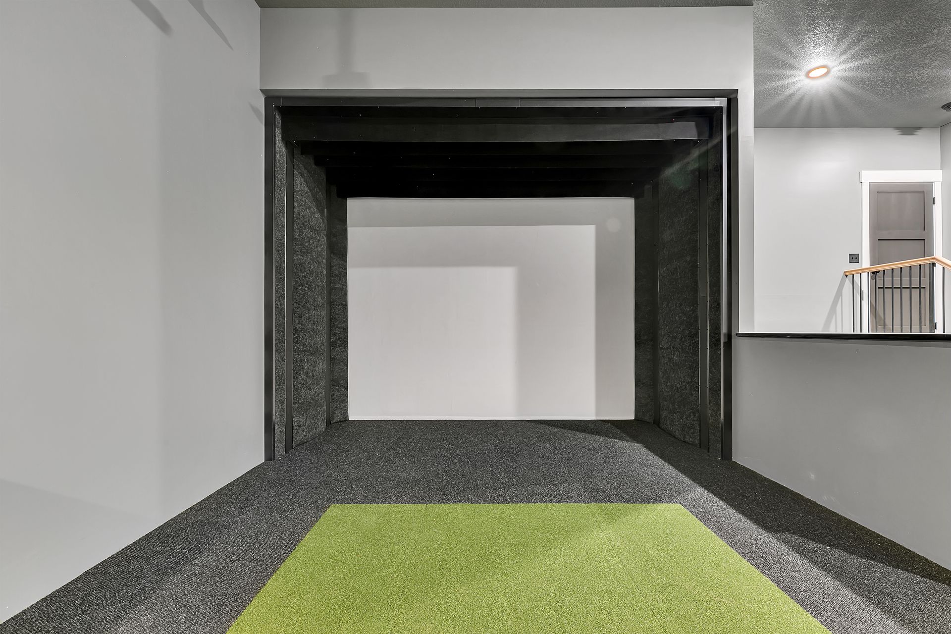 There is a green rug in the middle of the hallway.