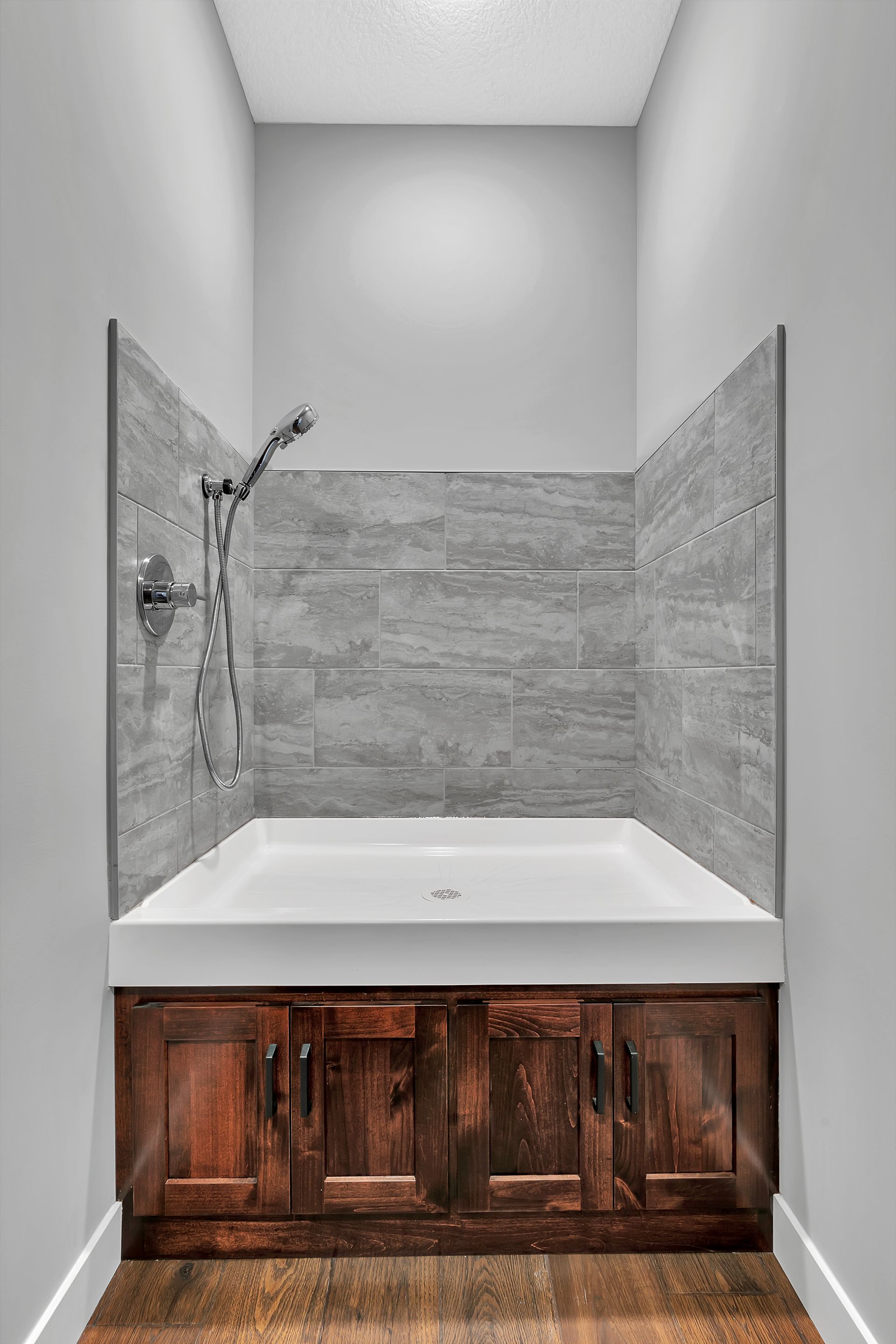 A bathroom with a bathtub and a shower.