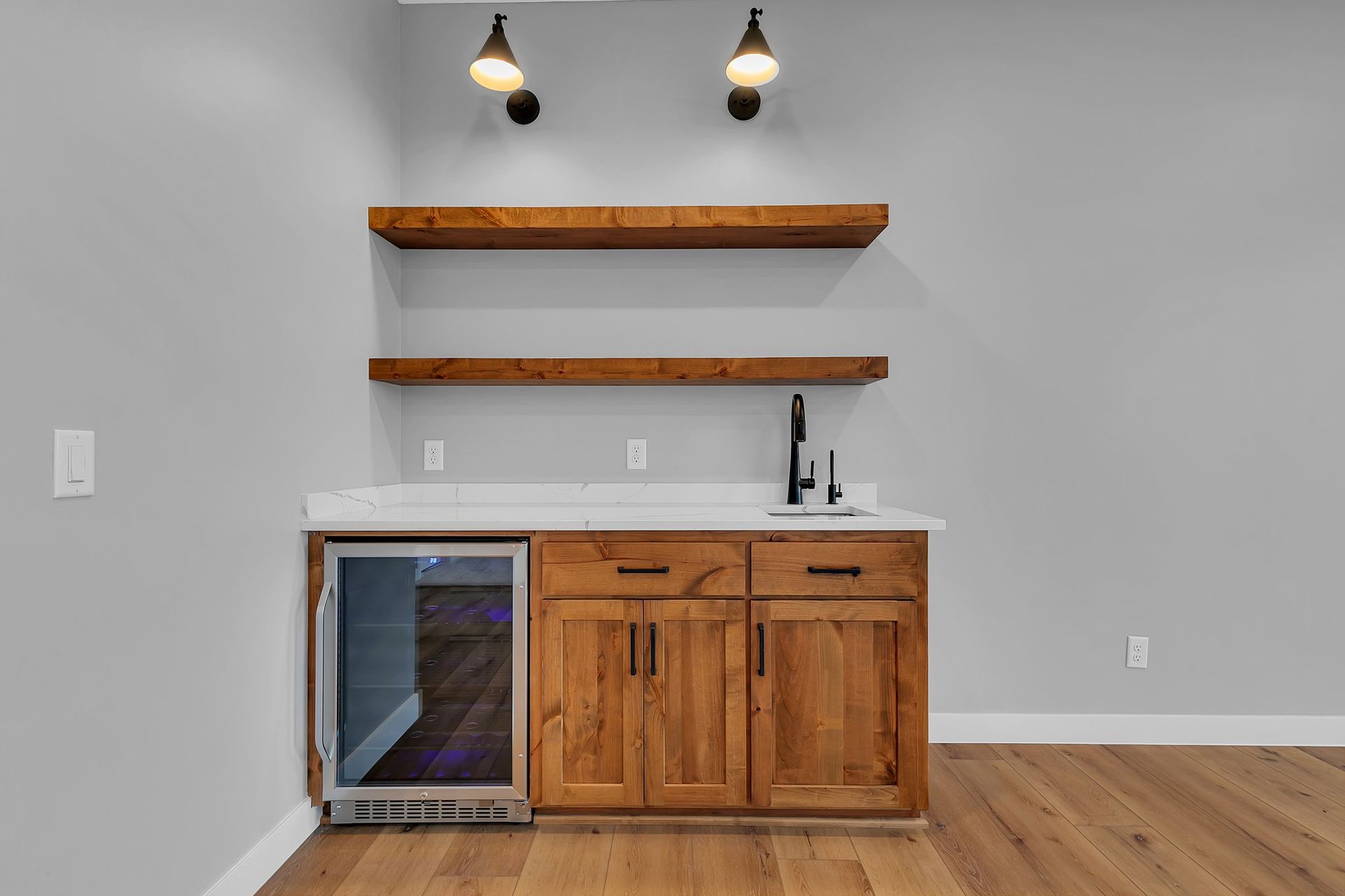 There is a refrigerator in the corner of the room.