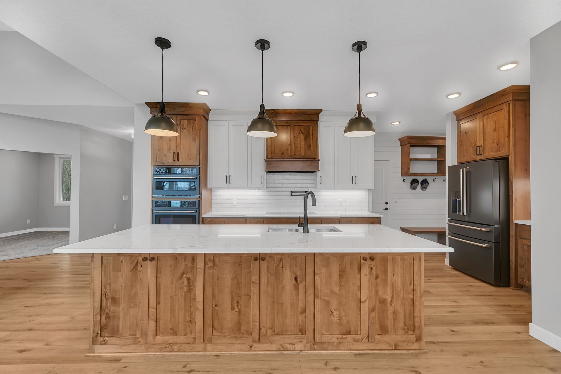 A kitchen with a large island in the middle of it.