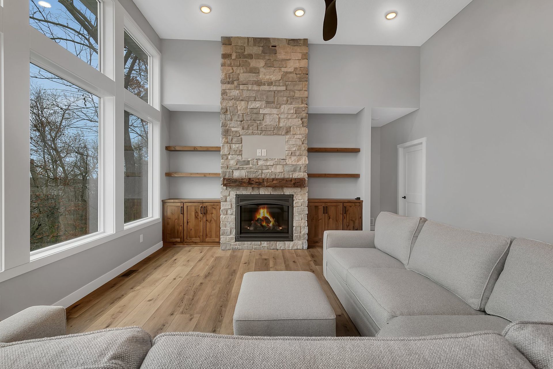 There is a fireplace in the middle of the living room.