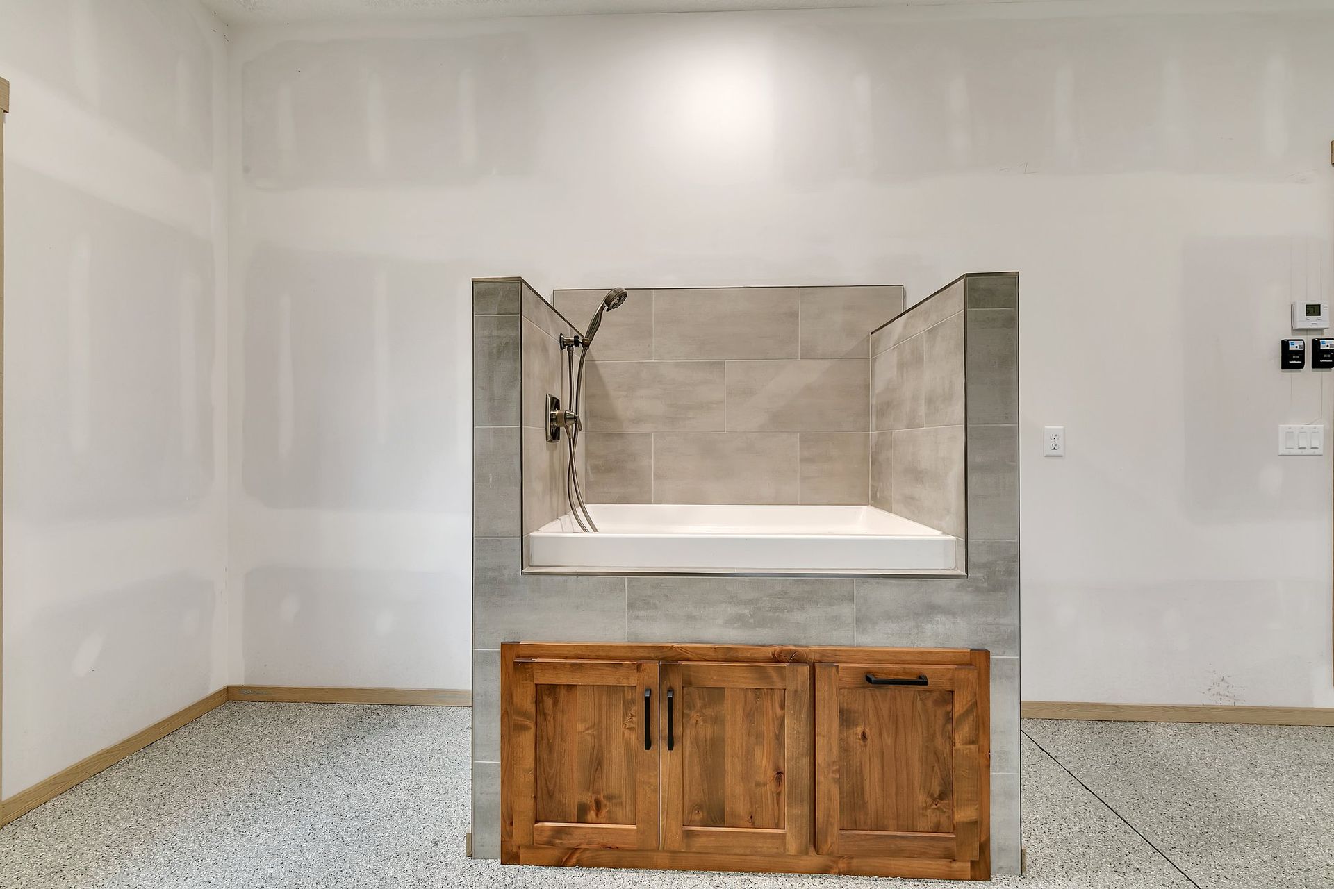 A bathroom with a dog bathtub and a shower.