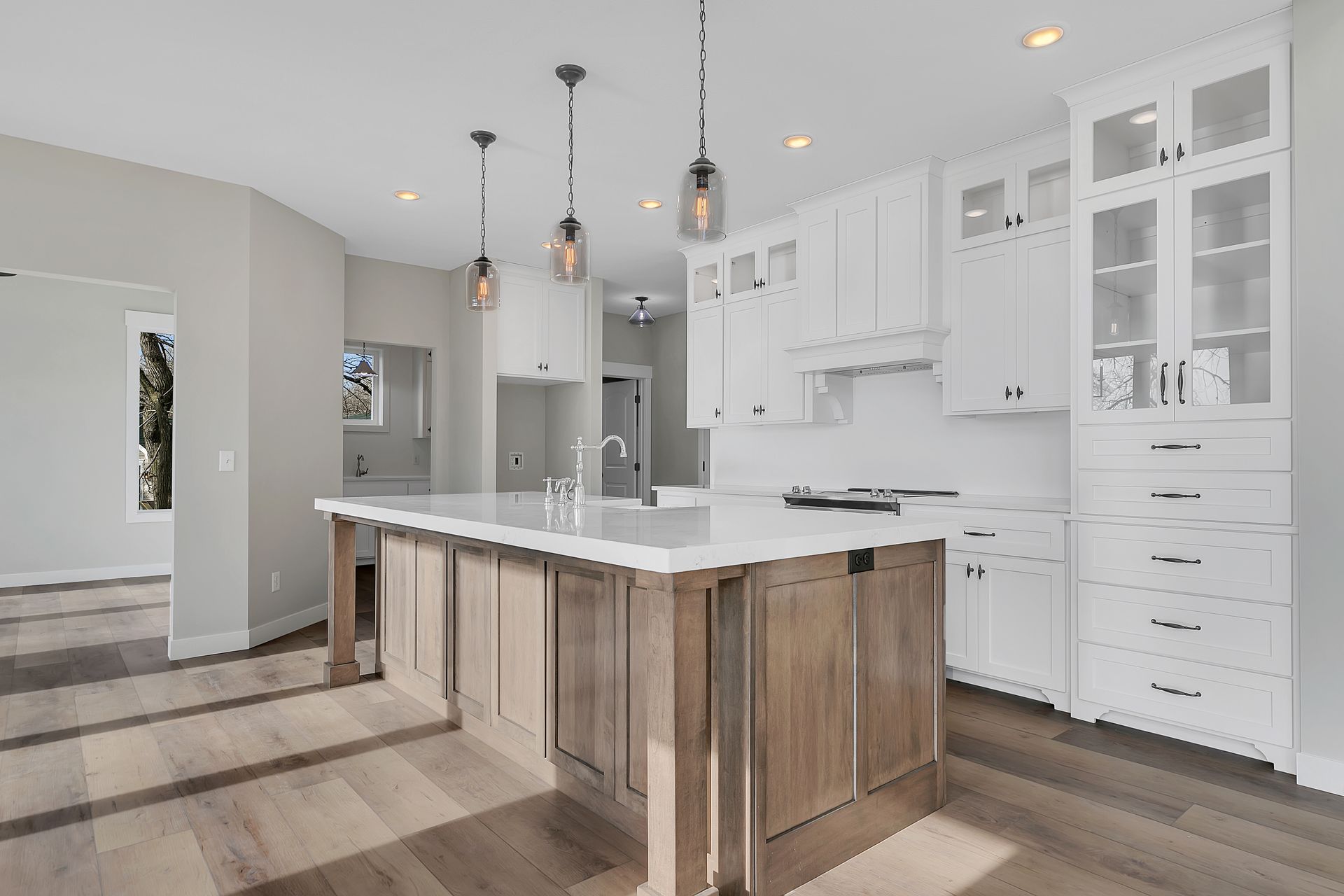 There is a large island in the middle of the kitchen.