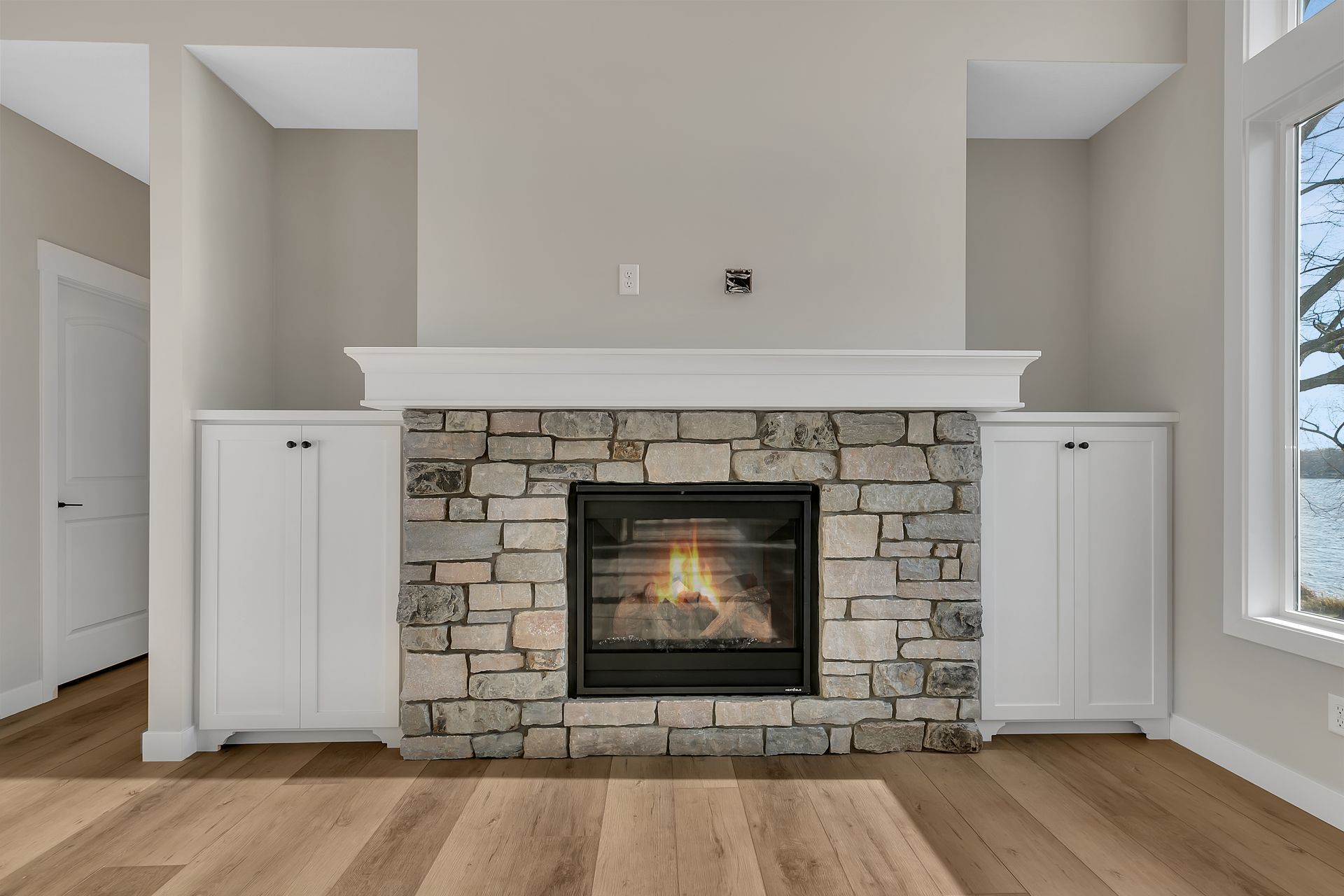 There is a fireplace in the middle of the room.