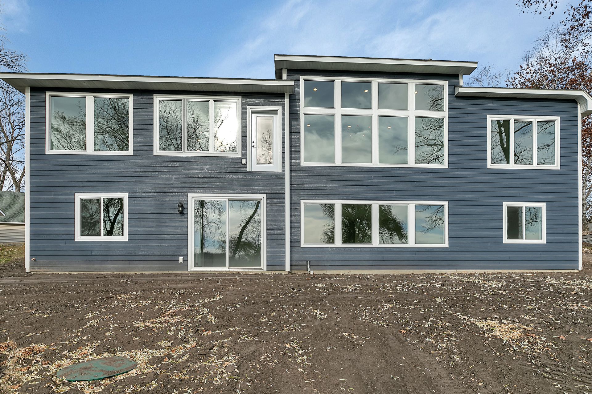 A large blue house with a lot of windows