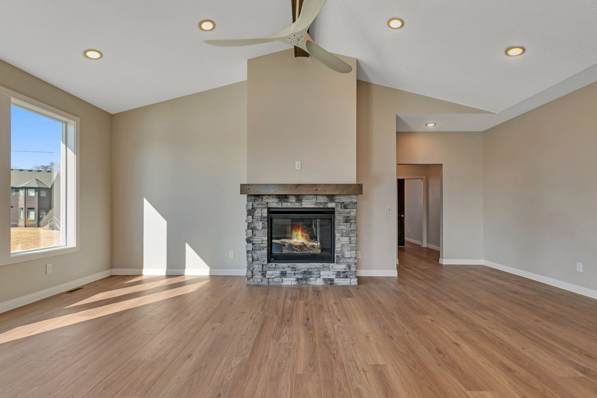 There is a fireplace in the middle of the living room.