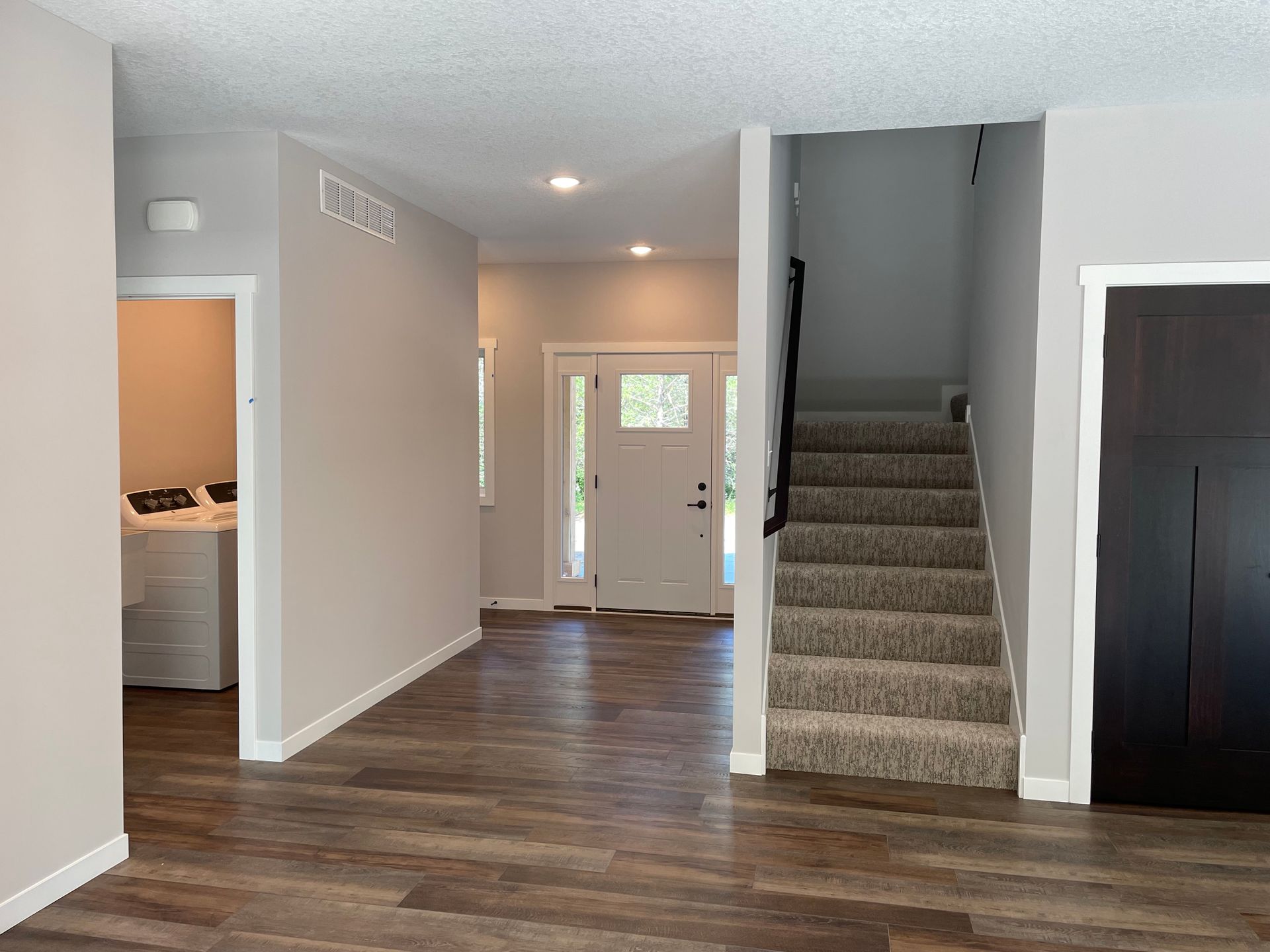 There is a staircase leading up to the second floor of a house.