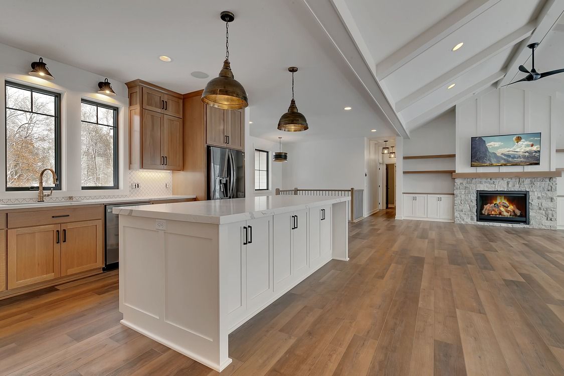 There is a large island in the middle of the kitchen.