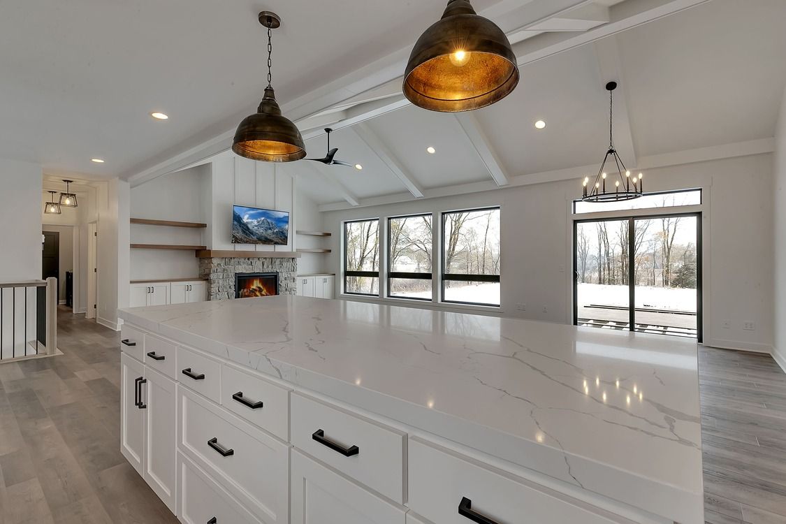 There is a large island in the middle of the kitchen.