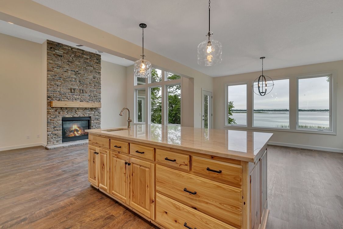 There is a large island in the middle of the kitchen.