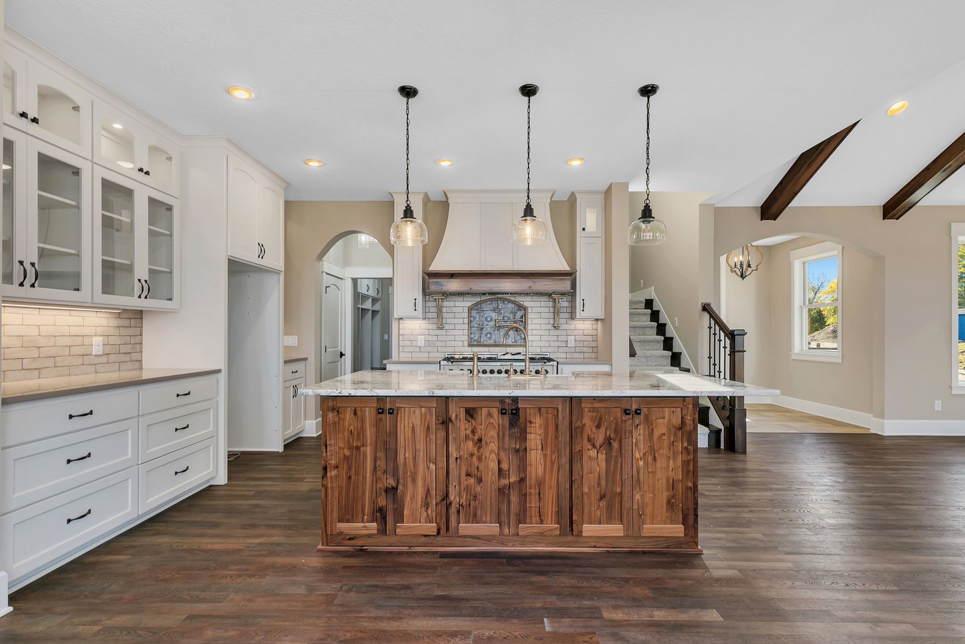 A kitchen with a large island in the middle of the room.