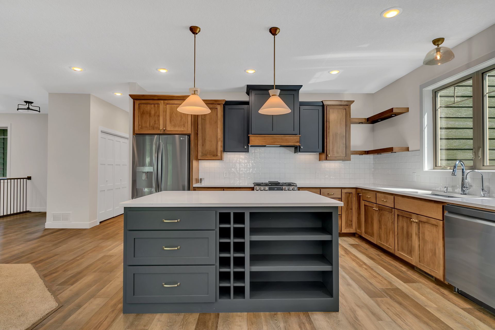 A kitchen with a large island in the middle of it.