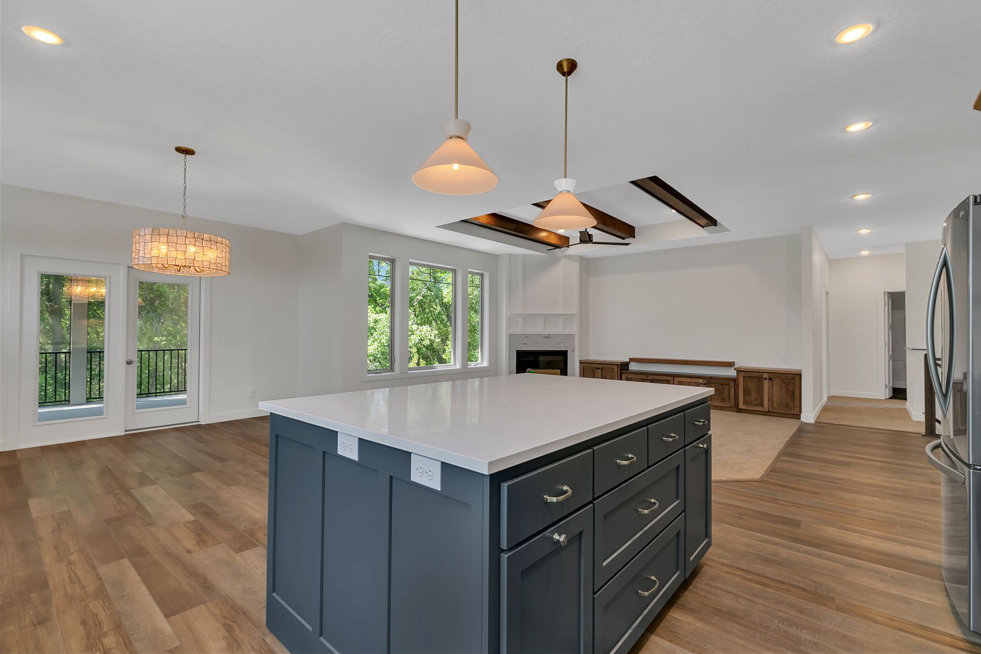 There is a large island in the middle of the kitchen.