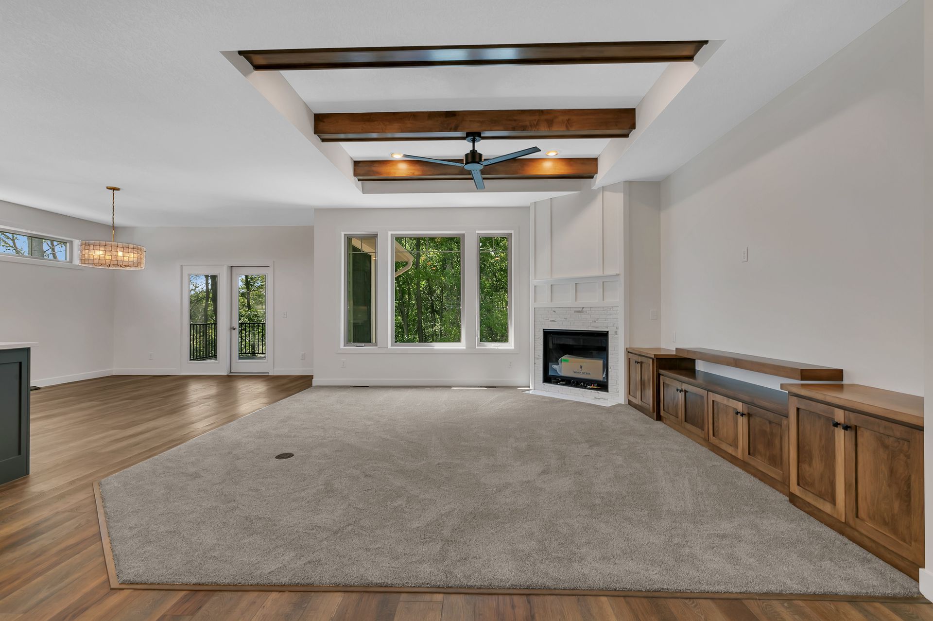 There is a fireplace in the middle of the living room.