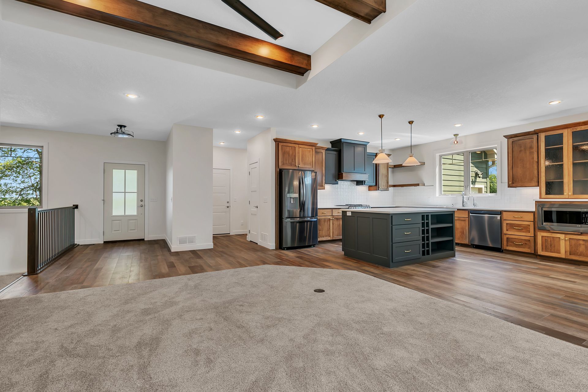 A kitchen with stainless steel appliances and wooden cabinets