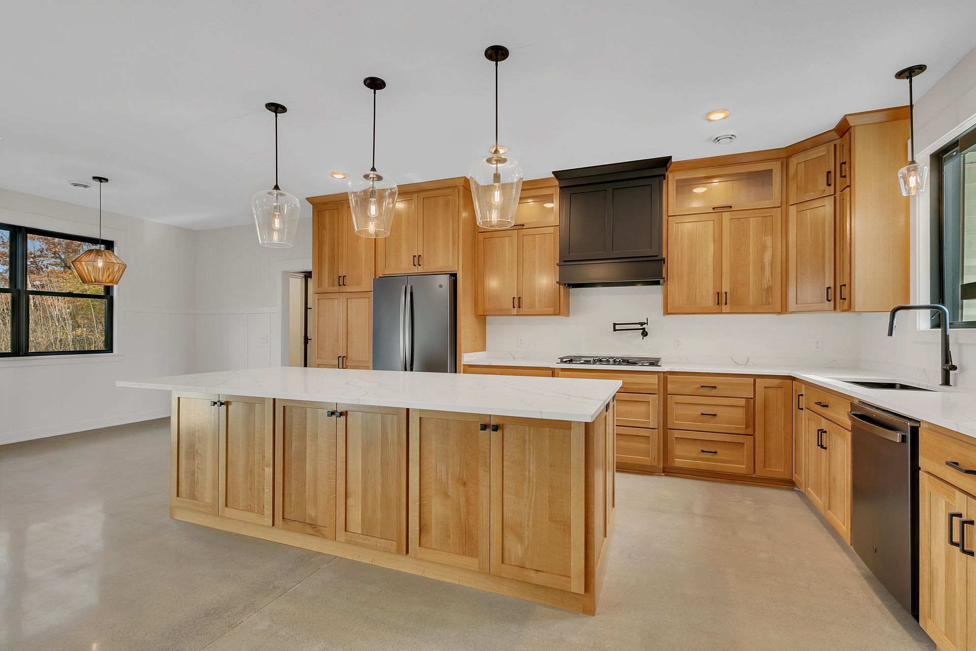 There is a large island in the middle of the kitchen.