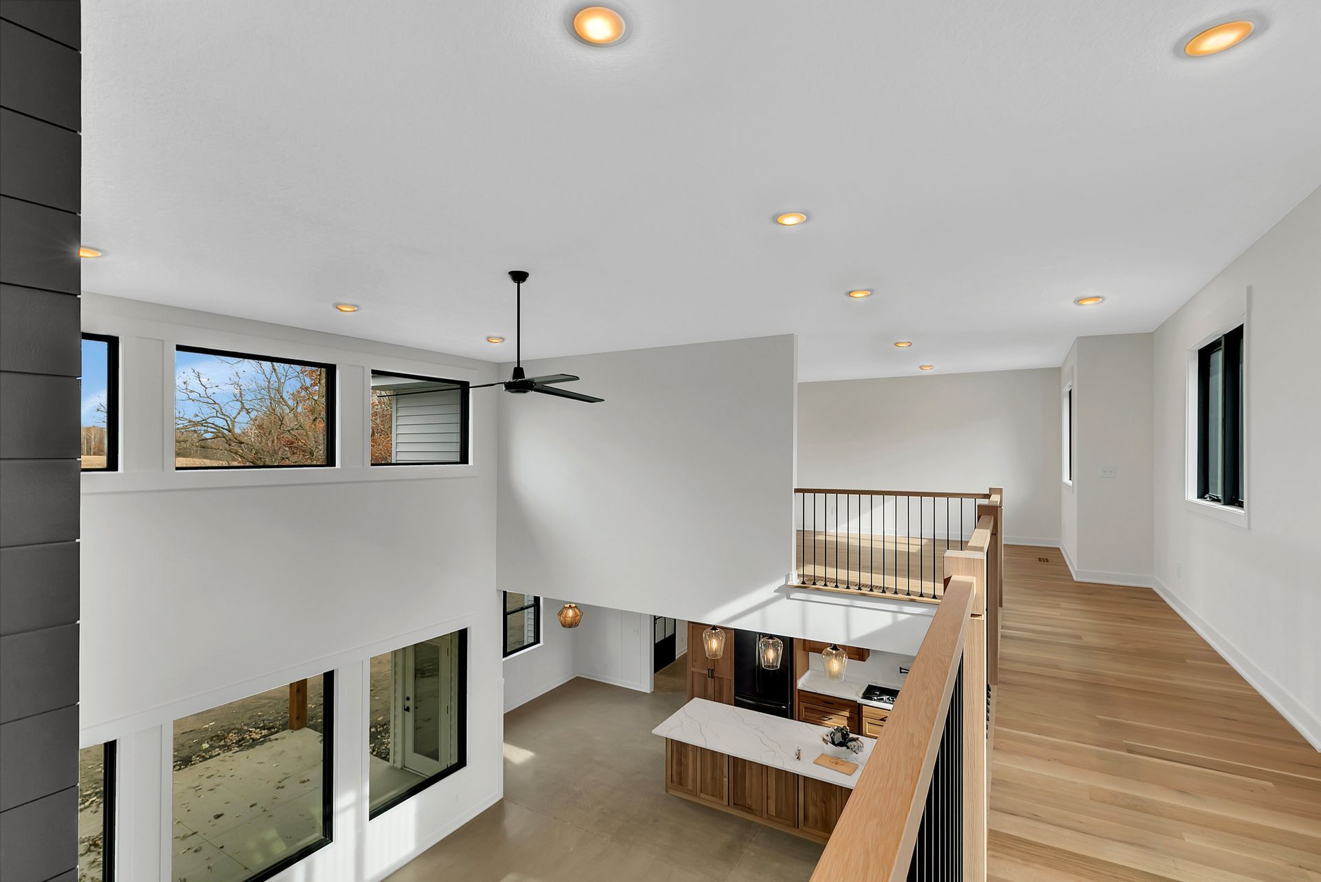 There is a ceiling fan in the middle of the room.