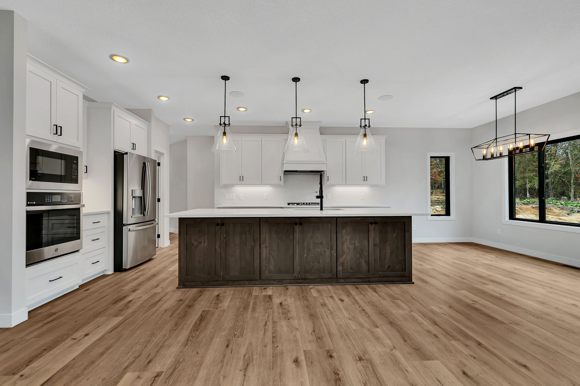 A kitchen with a large island in the middle of the room.