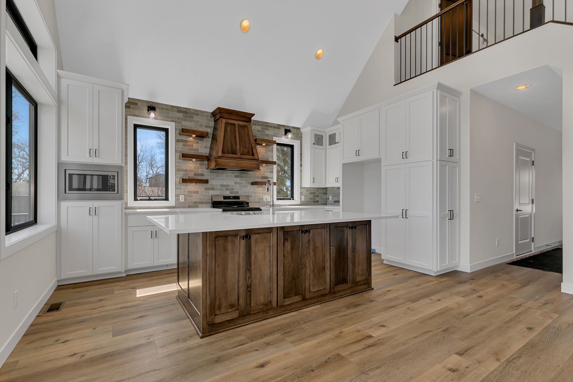 There is a large island in the middle of the kitchen.