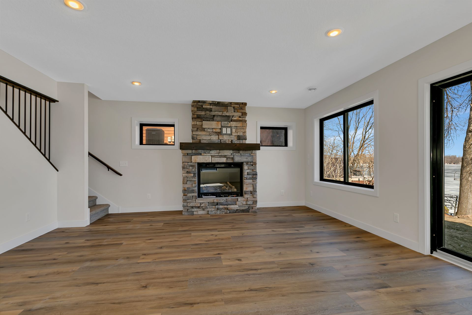 There is a fireplace in the middle of the living room.