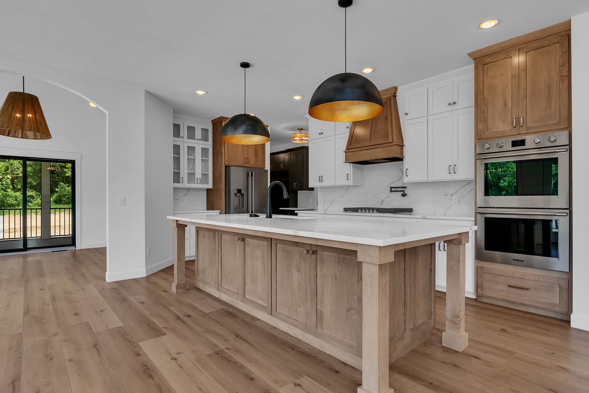 There is a large island in the middle of the kitchen.