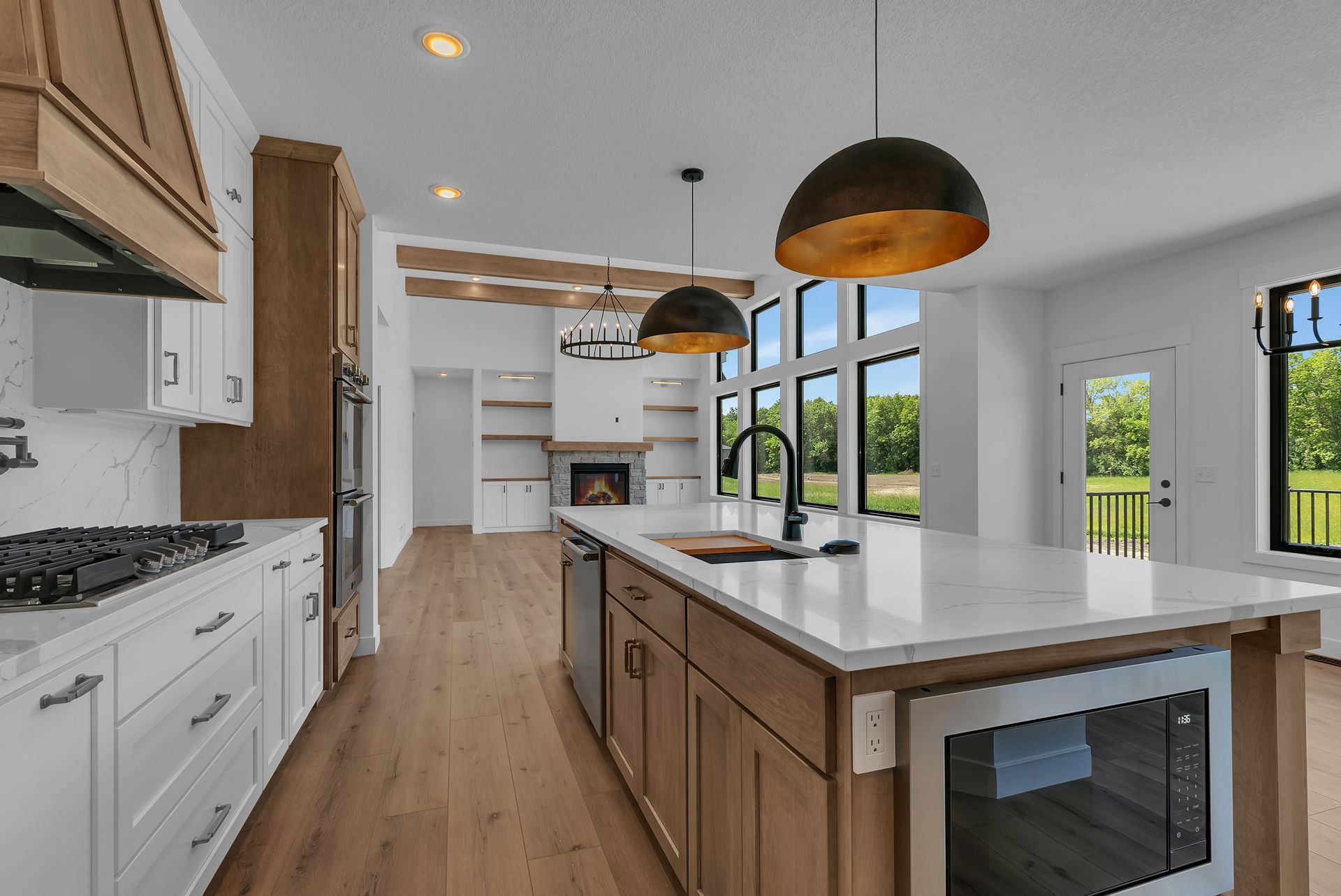 A kitchen with a large island in the middle of the room.