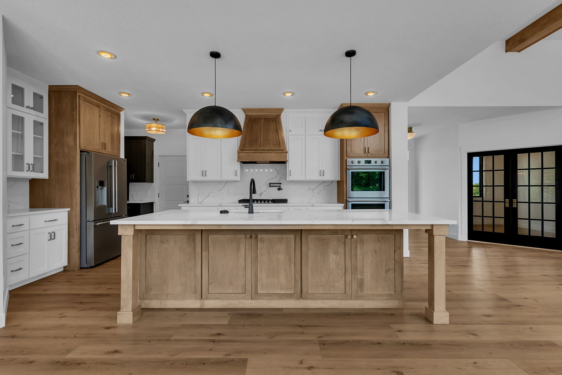 There is a large island in the middle of the kitchen.