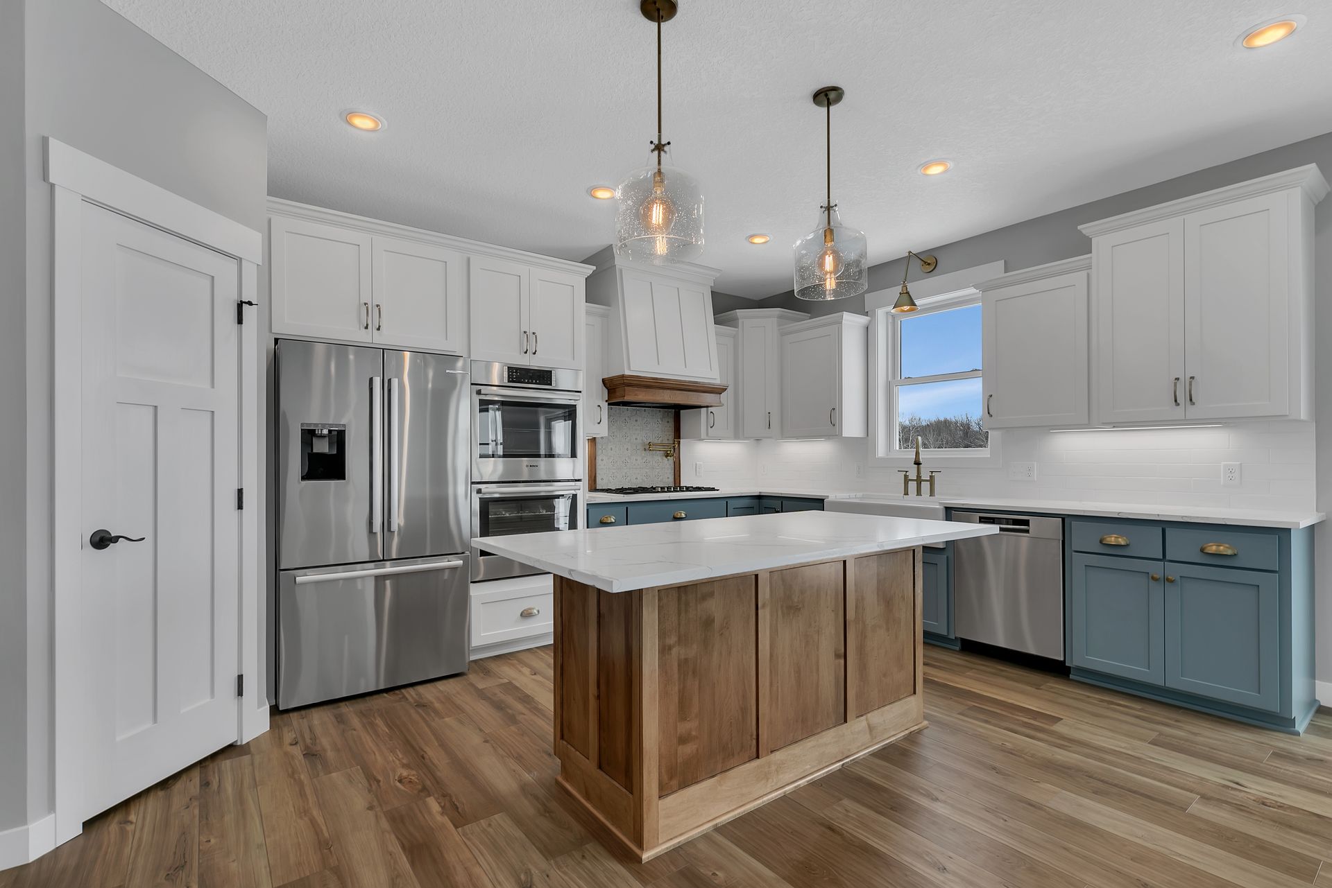 There is a large island in the middle of the kitchen.