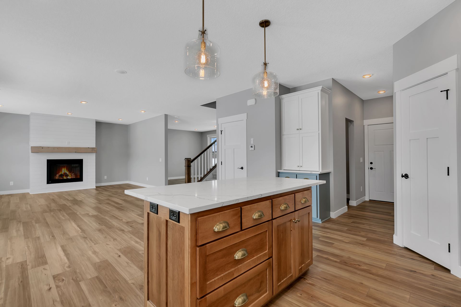 There is a large island in the middle of the kitchen.