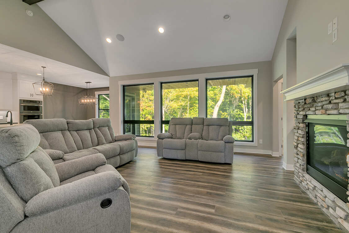 A living room filled with furniture and a fireplace.