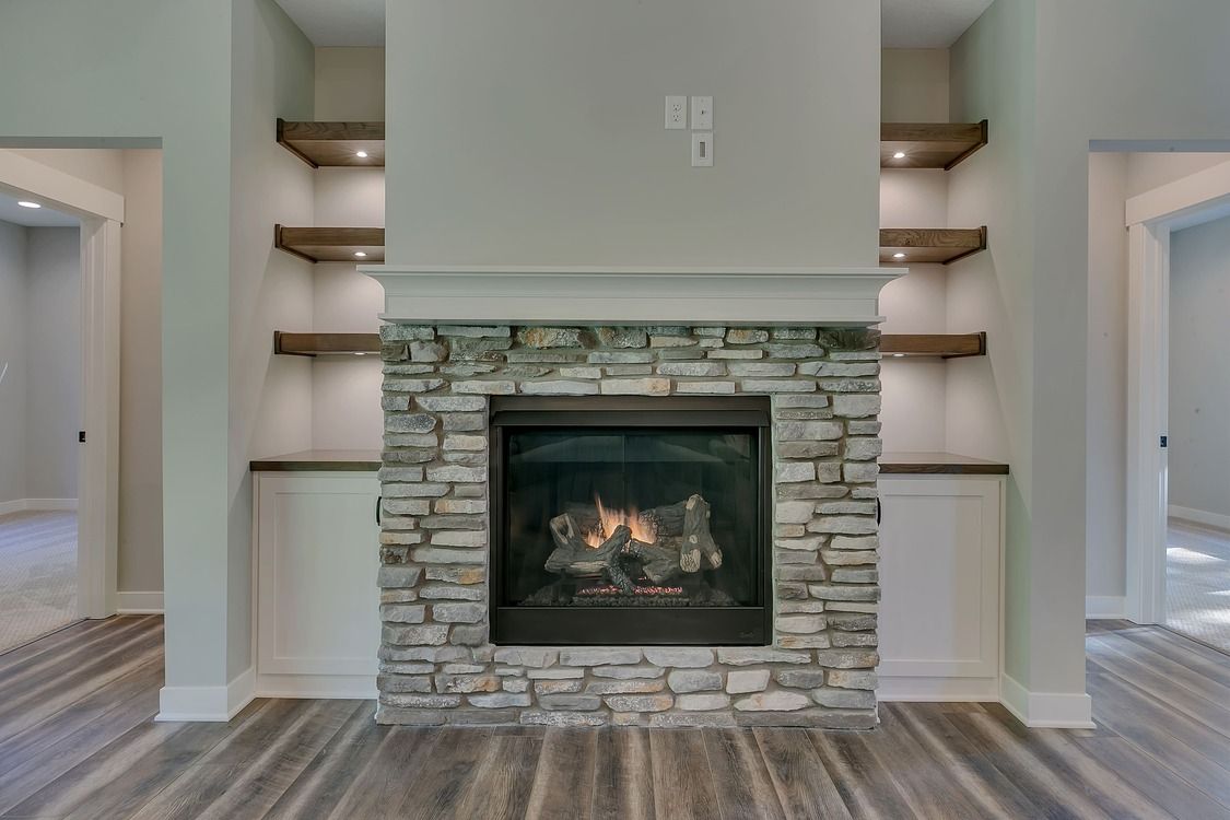 There is a fireplace in the middle of the room.