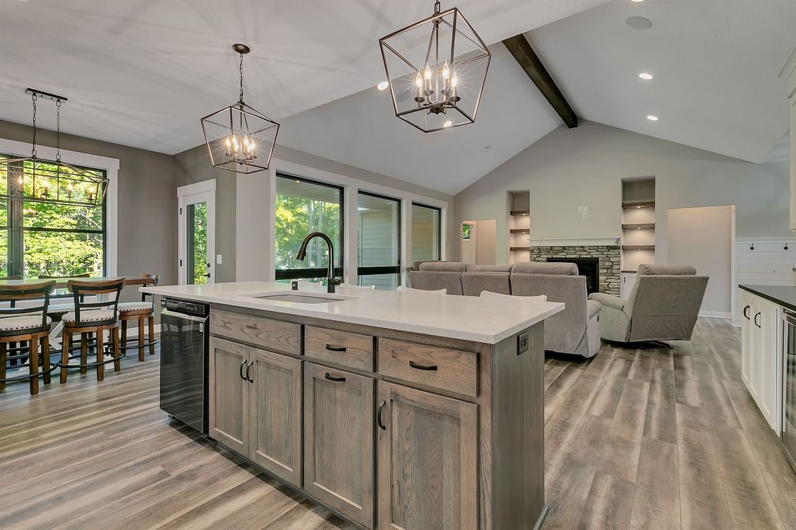 A kitchen with a large island in the middle of the room.