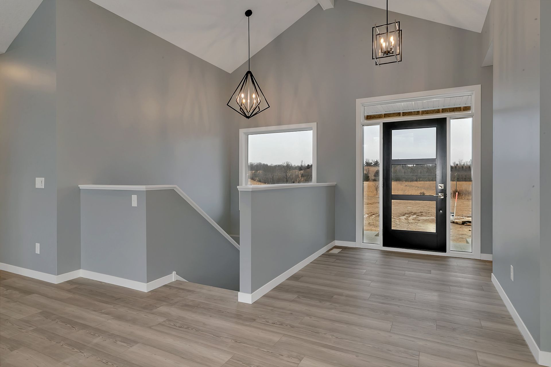 There is a staircase leading up to the front door of the house.