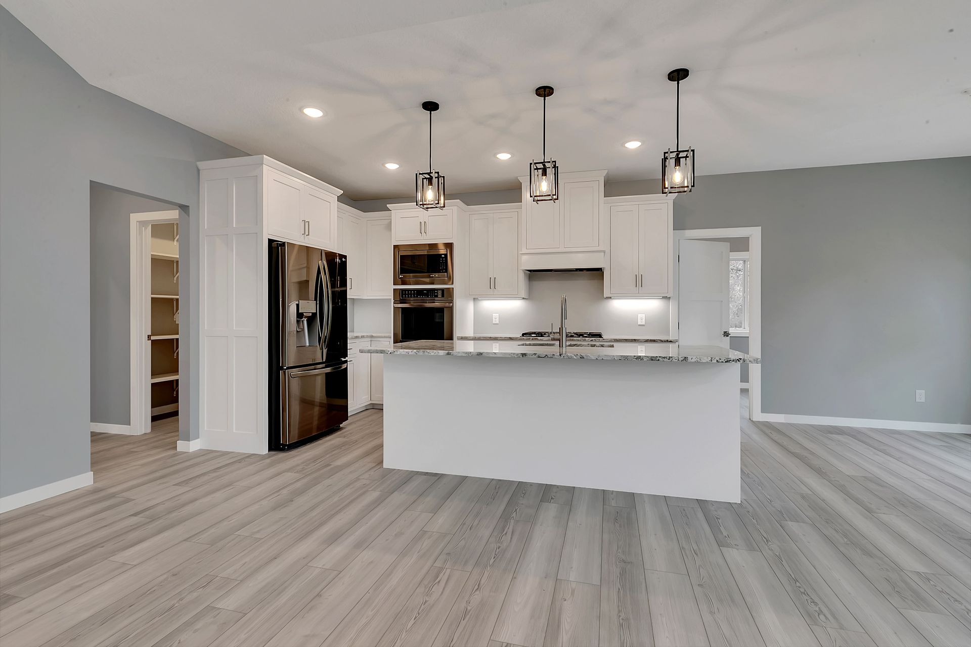 There is a large island in the middle of the kitchen.