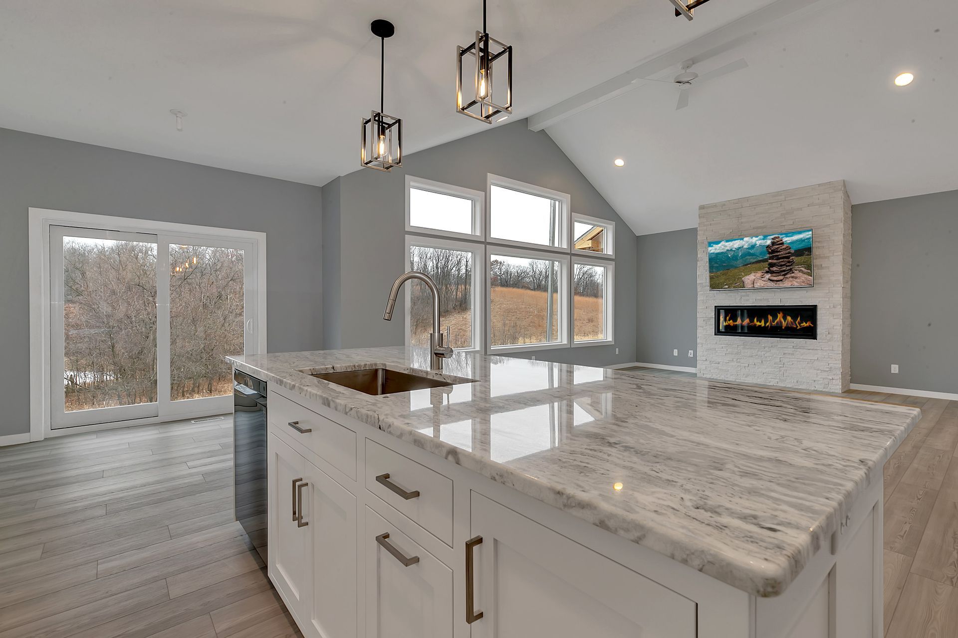 There is a large island in the middle of the kitchen.