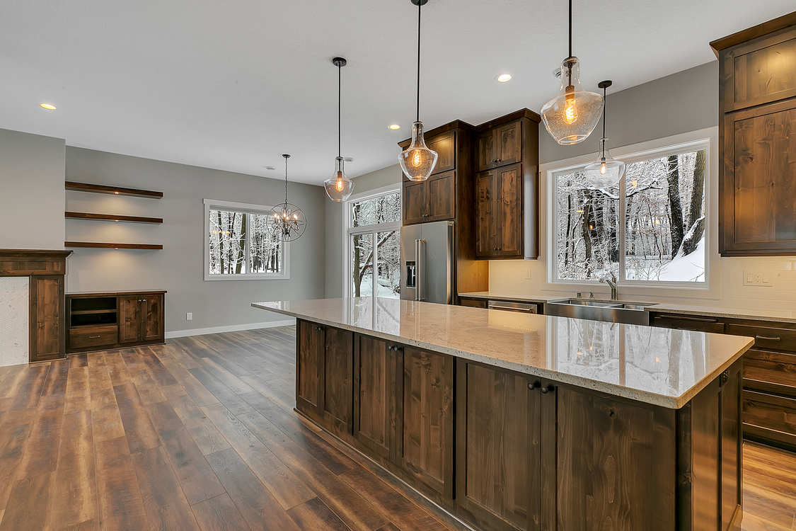 A kitchen with a large island in the middle of the room.