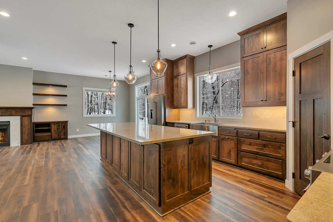 There is a large island in the middle of the kitchen.