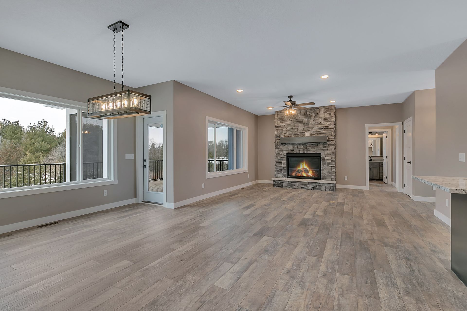 A kitchen with a large sink and a fireplace.
